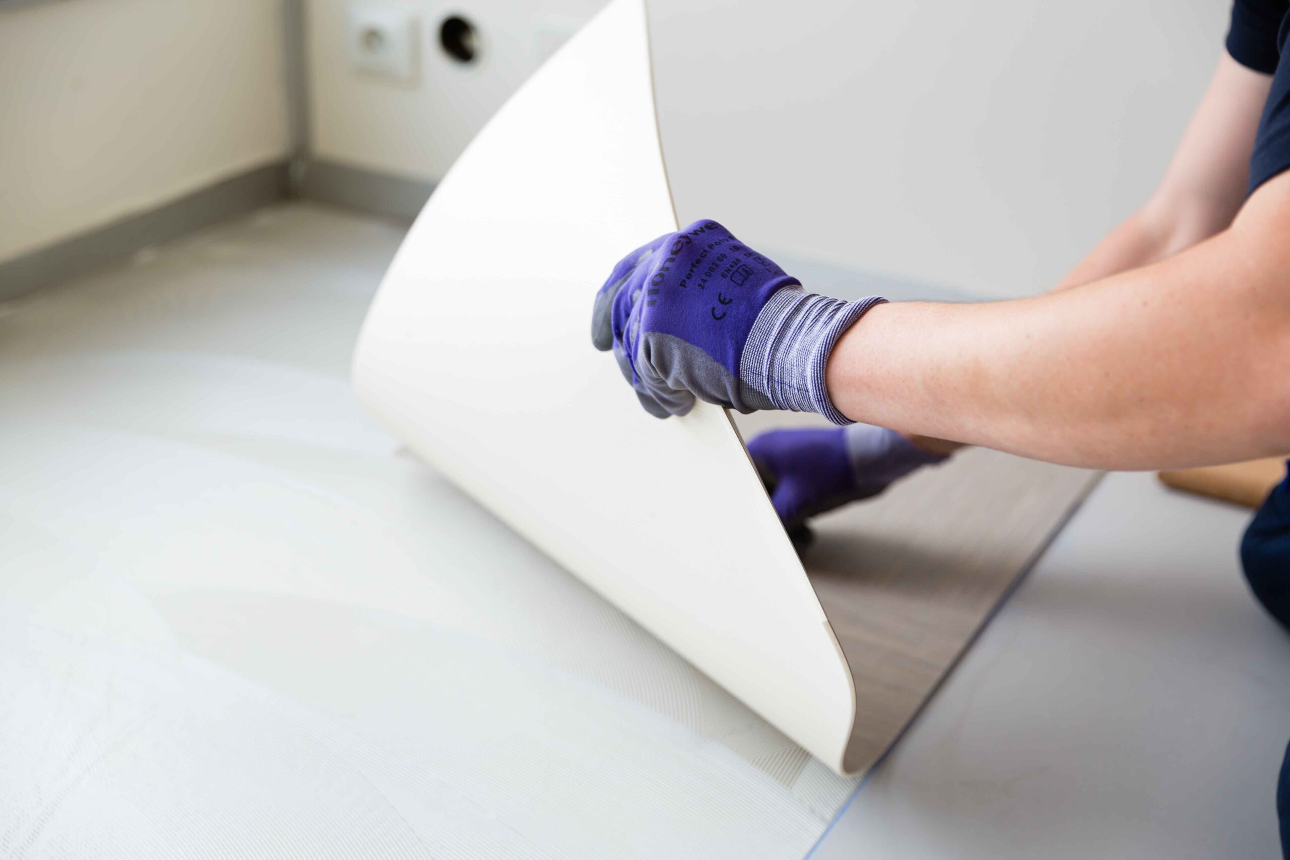 Flooring adhesive on PVC tiles