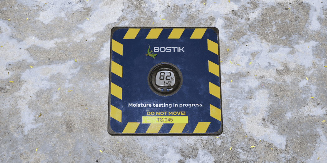 Image of a damp subfloor with a Bostik hygrometer